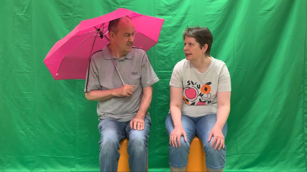Glynn and Rachel in front of the green screen