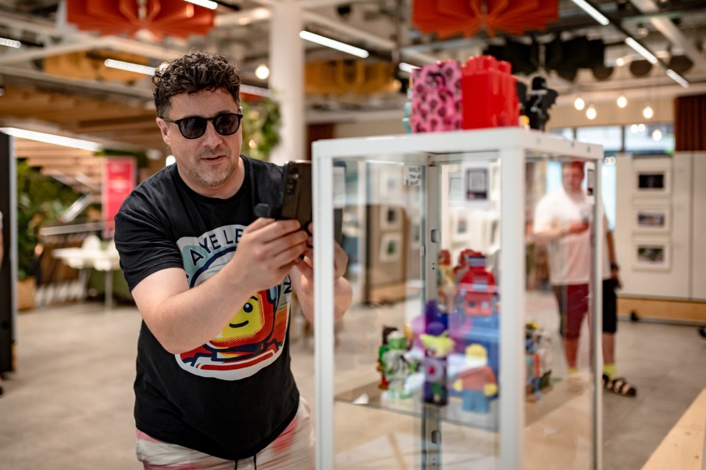 Founder and organiser, Mark Butcher taking a photo of Lego figures