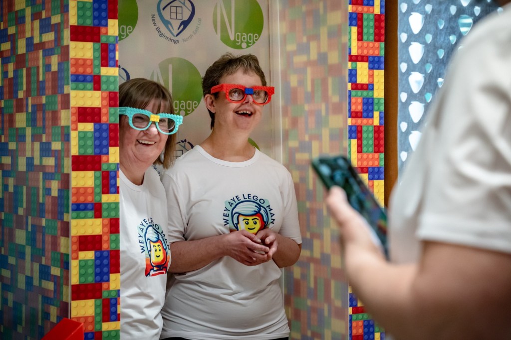 Exhibiting Artists​, Julie and Vicky being photographed in the Lego Photo Booth 