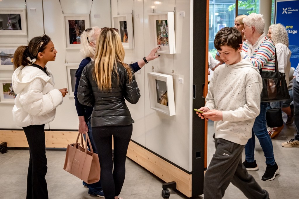 Attendees viewing the Lego portraits